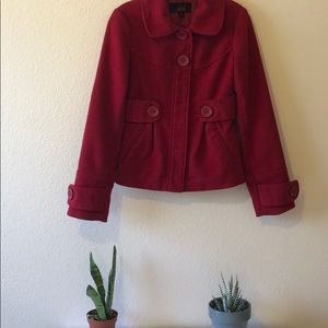 Red peacoat.